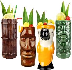 three tiki style vases with drinks in them