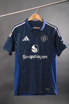 a soccer jersey hanging on a clothes line