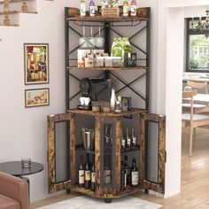 an open cabinet with bottles and glasses on it in a living room area next to a couch