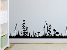 a wall decal with an image of mushrooms and grass