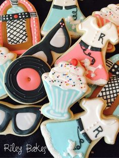 some decorated cookies are sitting on a table