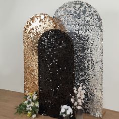 two large sequins are on display with flowers