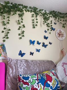 a living room filled with furniture and lots of butterflies on the wall