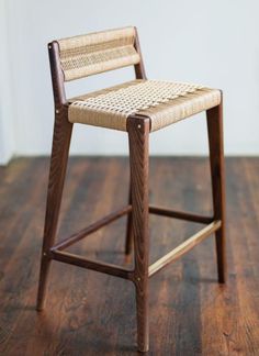 a wooden chair sitting on top of a hard wood floor