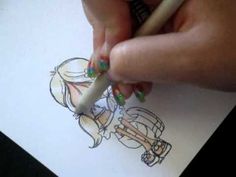 a person is drawing on paper with a pencil