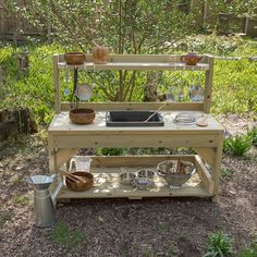 a potting bench with pots and pans on it