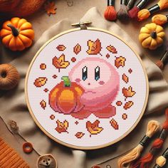 a cross stitch pattern with an image of a pumpkin