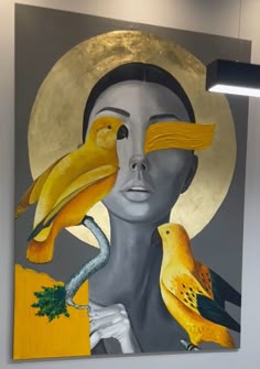 a painting with two birds on it and a woman's face in the background