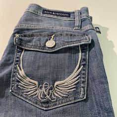 Rock Republic Womens Sz 8 29 -30 Waist Embroidered Wing Denim Jeans. Get pictures for measurement. Excellent Condition. A rare find. Thank you for looking C4 Embroiderd Jeans, Early 2000s Aesthetic Grunge, Low Waisted Jeans Y2k, 2000s Aesthetic Grunge, Jeans Pocket Design, My Own Clothing Brand, Gothic Jeans, Jean Upcycle, Own Clothing Brand