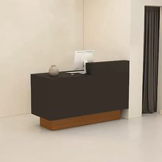 a black reception table in an empty room