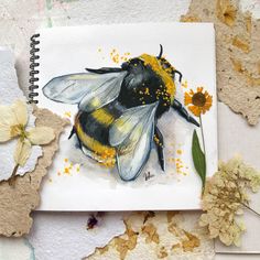 a drawing of a bee with yellow and black markings on its body, surrounded by dried flowers