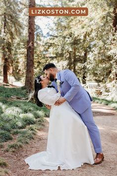 a bride and groom kissing in the woods on their wedding day at lizkoston com