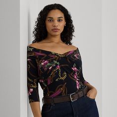 With an overlapping off-the-shoulder neckline and a slim-fitting silhouette this long-sleeve top melds an equestrian-inspired belting print with a painterly floral motif. This style is made with stretch-infused jersey for a soft hand and ease of movement. Luxury Long Sleeve Multicolor Print Top, Fitted Off-shoulder Floral Print Top, Luxury Multicolor Print Long Sleeve Top, Black Long Sleeve Floral Print T-shirt, Painterly Floral, Black Floral Print Top With 3/4 Sleeves, Dress Shirts For Women, Soft Hands, Soft Hand