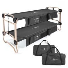 two black folding beds with wheels and carrying bags