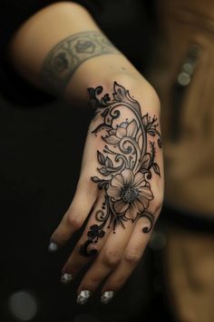 A detailed floral tattoo on a person's hand. Long Finger Tattoos For Women, Womens Finger Tattoo, Full Hand And Finger Tattoo, Vine Hand Tattoos For Women, Full Hand And Finger Tattoos For Women, Dark Finger Tattoos For Women, Finger Tattoo Designs For Women, Intricate Finger Tattoo, Seductive Tattoos