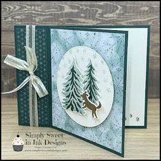 a handmade christmas card with a deer and pine trees