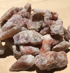 some type of rock sitting on top of a wooden table