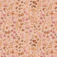 an orange and pink flowered fabric with small flowers on the side, all over it