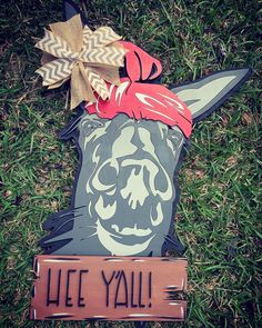 a wooden sign with a dog's head on it that says, lie you