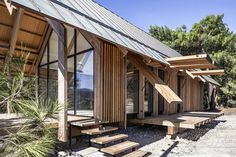 a wooden building with stairs leading up to it