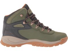 a pair of green and brown hiking boots