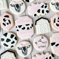 decorated cookies with farm animals and words on them for a baby shower or birthday party