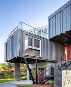 a couple of buildings that have stairs going up to the second floor and another building in the background