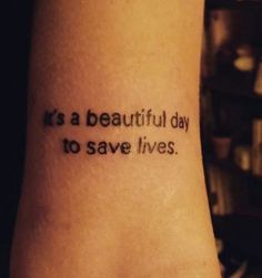 a tattoo saying it is a beautiful day to save lives