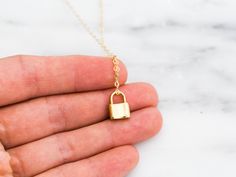 "Dainty lock necklace! The pendant is made of gold vermeil, which is heavy gold plating over sterling silver. Pair it with your favorite outfit! Layer with other necklaces, by or wear itself for a pop! . . . . . . . . . . . . . . . . . . . . . . . . . . . . . . . . . . . . . . . . . . NECKLACE + Length: 16\" + 2\" extender + Vermeil (18k gold plating over sterling silver) -or- sterling silver lock pendant: 8mm x 11mm + 14k gold filled -or- sterling silver chain, spring clasp, & findings LAYE Yellow Gold Chain Necklace With Gold Clasp As Gift, Gold Locket Necklace With Lobster Clasp As Gift, Gold Locket Chain Necklace As Gift, Gold Locket Chain Necklace For Gift, Everyday Gold Lock Jewelry, Everyday Gold Jewelry With Lock Detail, Gold Lock Necklace As Gift, Gold Chain Necklace With Lock For Gift, Yellow Gold Necklace With Lock As Gift