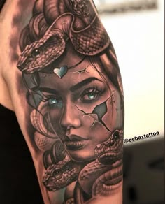 a woman's arm with a tattoo on it and two snakes around her head