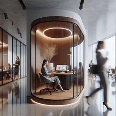 a woman sitting at a desk in an office