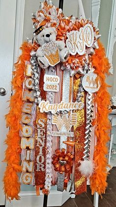 a door decorated with orange and silver decorations