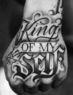 a hand with the words king of my soul tattooed on it