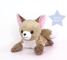 a brown and white stuffed animal with a star on it's side, sitting in front of a white background