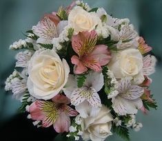 a bouquet of white and pink flowers