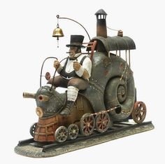 a statue of a man riding on the back of a train with an electric engine