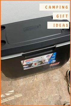 a black cooler with camping gift ideas on it