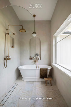 a white bath tub sitting next to a window