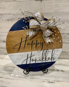 a happy hanukkah sign with a bow on it