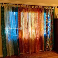 the curtains in this room are made from different colors and patterns, but not very large enough to hang on