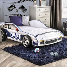 a police car bed is shown in this bedroom