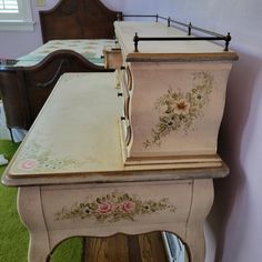 two old dressers with painted flowers on them