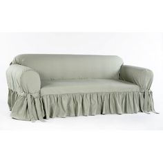 a couch with a ruffled cover on it's arm and back, sitting in front of a white background