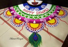 a decorated diya with the words happy diwal written on it and a peacock tail