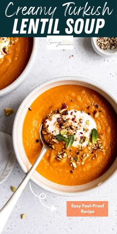 two bowls filled with soup and topped with cream