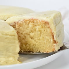 a close up of a cake on a plate with a slice cut out of it