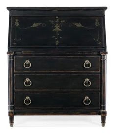 an old black chest with drawers and knobs on the front, sitting against a white background