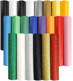 various colors of glitter paper are lined up in a row on a white background,