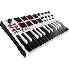 an electronic keyboard with multiple keys and knobs