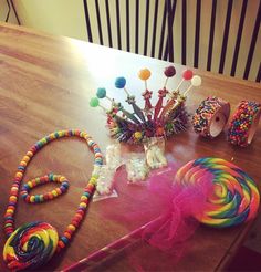 a table with candy, lollipops and candies on it